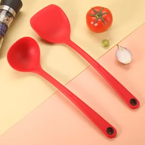 Red silicone kitchen utensils set featuring soup ladle and spatula for non-stick cookware.