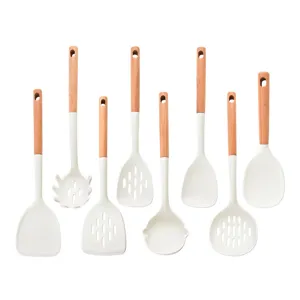 Ensemble d'ustensiles de cuisine en silicone et bois, spatules et louches résistantes à la chaleur.
