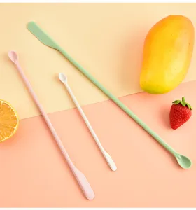 Close-up detail view of multi-color double-ended silicone mini spatulas and spoons for jars.