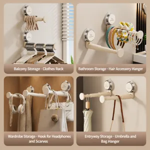 Wandgemonteerde uitschuifbare kledinghanger zuignap organizer multifunctioneel opbergrek voor thuis.