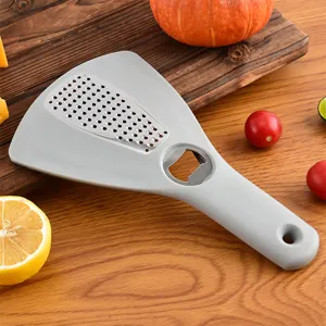 Râpe de cuisine multifonctionnelle et ouvre-bouteille avec grille en inox pour fromage et agrumes.