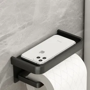 Gun grey space aluminum toilet paper holder with phone storage shelf for modern bathroom.