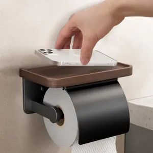 Walnut wood toilet paper holder with phone storage shelf for bathroom wall mounting.