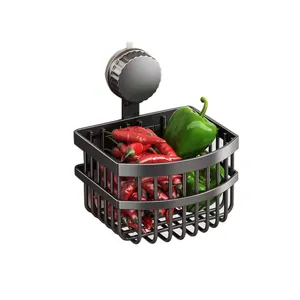 Cesta de almacenamiento con ventosa negra para pared de cocina para organizar ajos.