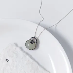 Exquisite S925 silver Hetian jade fortune bag pendant necklace, minimalist vintage style.