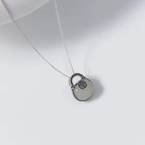 Delicate S925 silver Hetian jade bag pendant necklace featuring a traditional lucky Fu charm.