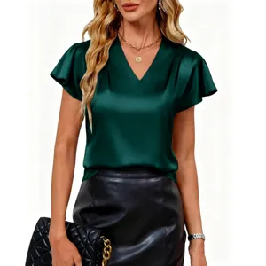 Detailed view of women's short sleeve V-neck green top, elegant casual summer fashion wear.