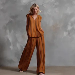 French minimalist striped linen two-piece set, loose sleeveless top and wide-leg pants.