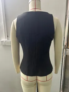 Back view detail of a black sleeveless suit vest, elegant and professional inner wear.