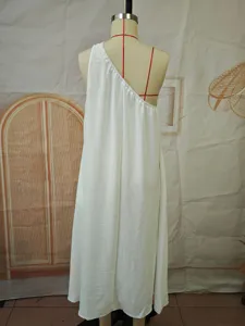 Detail view of the elegant one-shoulder solid color sleeveless midi dress back style.