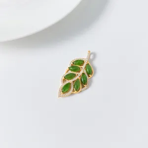 Detailed close-up view of the elegant green jade leaf pendant crafted with sterling silver.