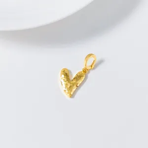 Detail shot of a stunning S925 silver gold-plated crushed ice heart pendant charm.