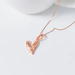 Close-up of S925 silver rose gold crushed ice heart pendant necklace minimalist design