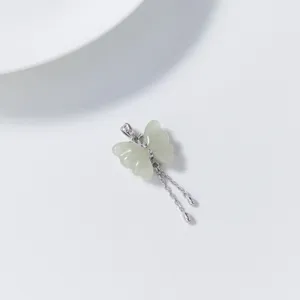 Exquisite S925 silver Hetian jade butterfly tassel pendant, minimalist chic jewelry detail view.