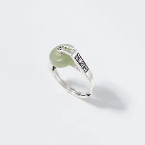 Detail shot of the S925 silver Chinese style Hetian green jade fortune ring band.