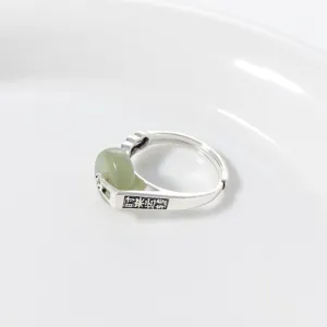 Close-up of S925 silver Chinese vintage Hetian green jade ring showing delicate detail.