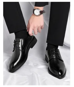 Men's black formal derby shoes detail view, classic leather dress shoes for business and weddings.