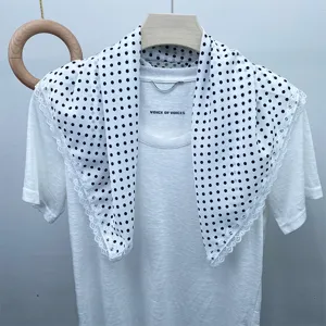 Silk polka dot scarf with delicate lace trim, elegant and versatile women fashion accessory.