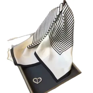 Elegant black and white silk scarf with geometric stripe design, perfect for women's daily wear.