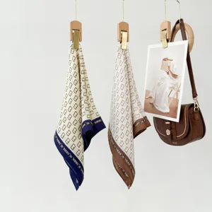 Chic silk small square scarf hanging on display, premium fashion neckerchief for women.