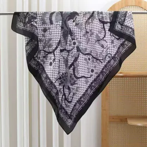 Elegant black and white silk square scarf featuring vintage bird and floral geometric prints.