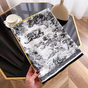 Silk scarf with classic jungle animal print, elegant black and white fashion accessory.