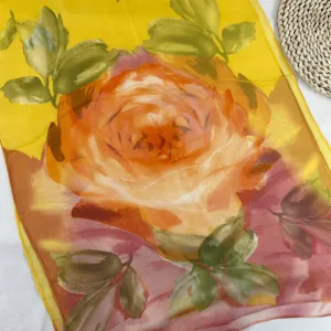 Exquisite detail of the women's gradient yellow floral silk scarf, lightweight chiffon texture.