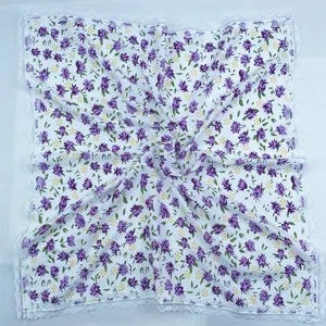 Detailed view of women floral square scarf with elegant white lace trim, soft fabric texture.