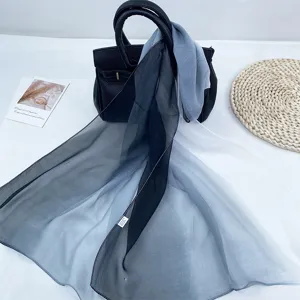 Gradient chiffon scarf detail showing soft fabric transition from black to white summer shawl