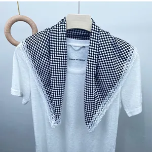 Chic black and white checkered silk scarf with delicate lace trim for versatile daily wear.
