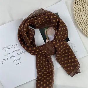 Detailed view of the brown polka dot georgette chiffon scarf, lightweight accessory flat lay.