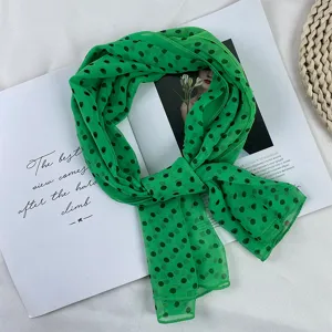 Green polka dot chiffon scarf detail, lightweight summer sheer neck wrap accessory.