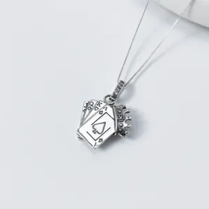 Close-up detail of S925 silver playing card crown pendant necklace with exquisite diamonds.
