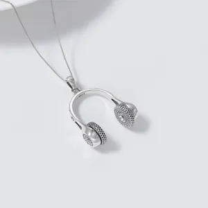 S925 silver headphone music note pendant necklace, exquisite minimalist designer jewelry detail.
