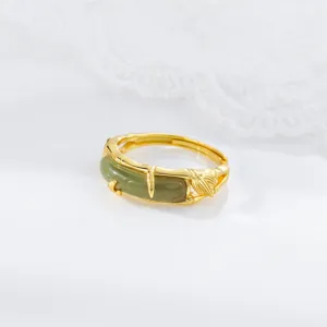 Close-up detail of S925 silver green jade ring with delicate bamboo leaf hollow design.