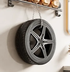 Wall mounted car wheel rim display rack with alloy wheel and tire for garage or room decor.