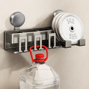 Wall-mounted suction cup toothbrush holder and bathroom organizer rack in modern grey finish.