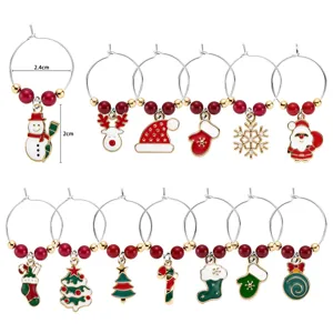 Christmas wine glass charms detail showcasing metal rings and festive holiday pendants.