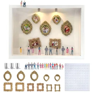 DIY Mini Museum Schattenbox Set mit goldenen Bilderrahmen und Miniatur Figuren Deko.