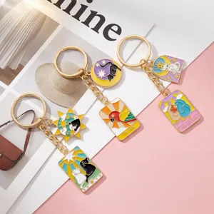 Metal enamel tarot card keychains with cute cats, parrots, and birds design, stylish bag charms.