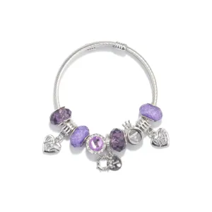 Detail view of silver snake chain charm bracelet with purple crystal beads and cute pendants.