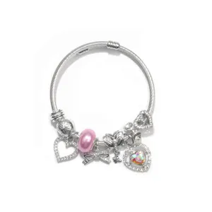 Silver snake chain DIY charm bracelet with pink bead and crystal heart pendants for women.