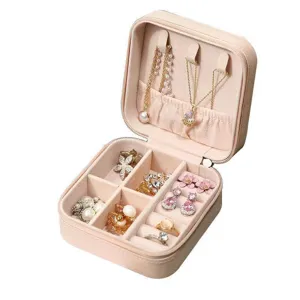 Compact portable pink PU leather jewelry storage box with zip, designed for rings and necklaces.