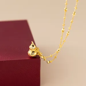 Exquisite gold-plated S925 silver gourd pendant necklace detail shot, showcasing sparkling stone inlay.