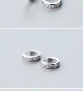 Detailed view of silver micro-paved cubic zirconia hoop earrings, elegant and simple daily wear.