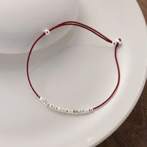 Minimalist S925 silver beaded red cord bracelet detail shot, elegant Chinese style accessory.