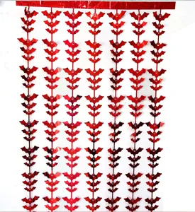 Close up of red metallic bat tinsel curtain string for Halloween party hanging decoration.