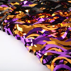 Halloween metallic tinsel fringe curtain wavy detail in black, purple and orange colors.