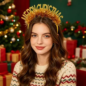 Detailed close-up of a festive Christmas headband featuring glittering gold MERRY CHRISTMAS letters.