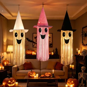 Halloween glowing ghost hanging decorations with witch hats for spooky party ambiance setup.